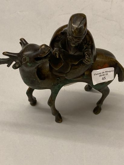 INDOCHINE Shoulao on his deer in bronze with brown patina and oxidations forming...