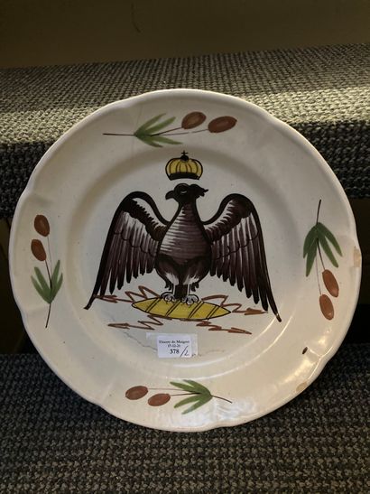 null Two French earthenware plates with polychrome decoration of a crowned eagle.
Early...