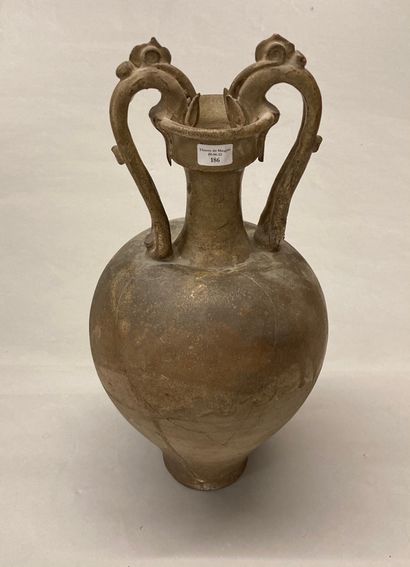 CHINE A stoneware two-handled baluster jar with a beige monochrome glaze and a stylized...