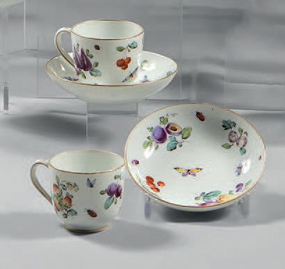Höecht Pair of porcelain cups and their saucers decorated in polychrome of fruits...