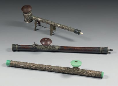 CHINE et VIETNAM Three opium pipes, one in bamboo, a second in silver with auspicious...