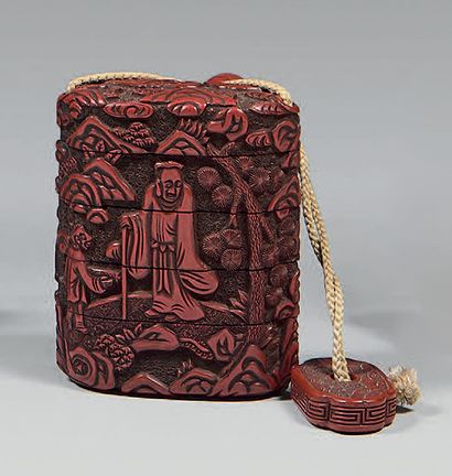 JAPON Inro with four boxes in red lacquer "tsuishu" with carved decoration of an...