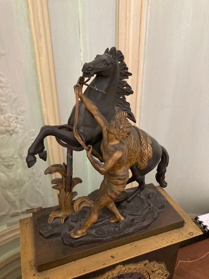 null Gilt bronze and patinated clock, decorated with a horse of Marly. Middle of...