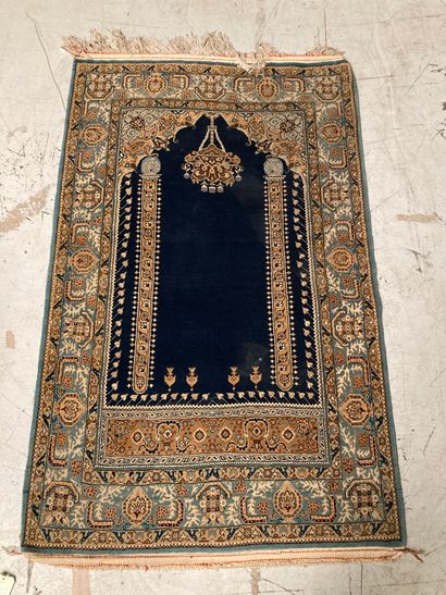 Prayer rug with blue background and interior...