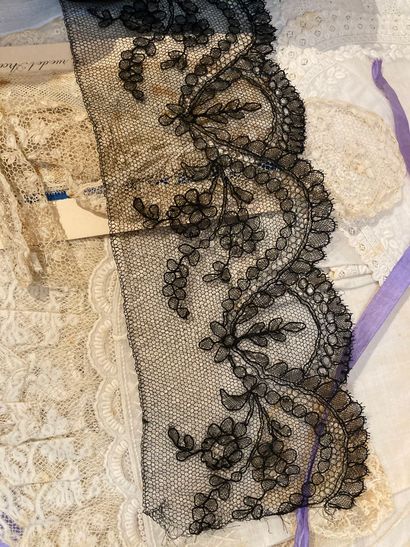 null Lot including white and black lace (ref 233) and a small quilted purse with...