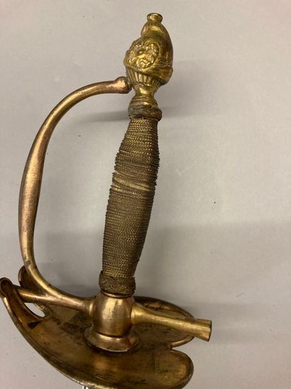 null Officer's sword, uniform model, gilt brass guard, pommel in the form of a helmet...