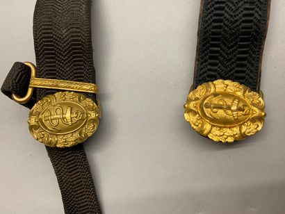 null Two naval officer's belts, in black braided wire, lined with black morocco;...