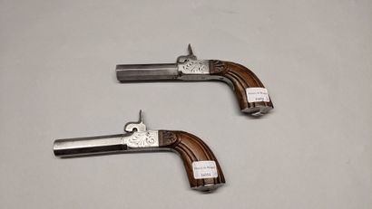  Pair of boxlock pistols, octagonal barrels with forced bullet, engraved chests,...