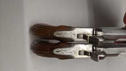 null Pair of boxlock pistols, octagonal barrels with forced bullet, engraved chests,...