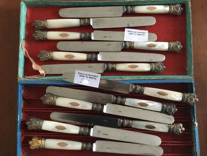 null Twelve knives, mother-of-pearl and gilt metal handles, metal blades, 19th c...