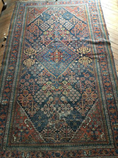 null Persian carpet with floral decoration (wear) 275 x 425 cm 

 Blue background...
