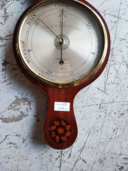 null Lot: barometer in veneer H.: 92 cm and wall clock radiant decoration and shell...