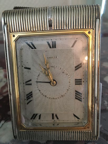 null CARTIER. Silver alarm clock with guilloche background, length : 8,5 cm (ref...