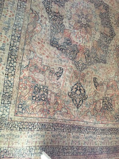 null Persian carpet with floral decoration (wear) 275 x 425 cm 

 Blue background...