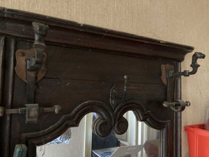 null Wall-mounted checkroom in molded and carved wood, mirror upper part. 

Size:...