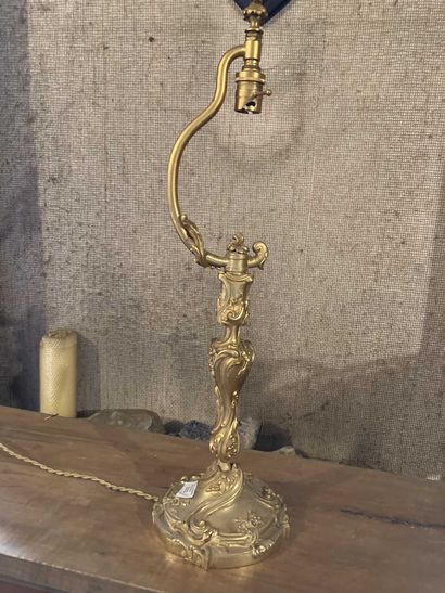 Torch in gilded bronze with rocaille decoration....