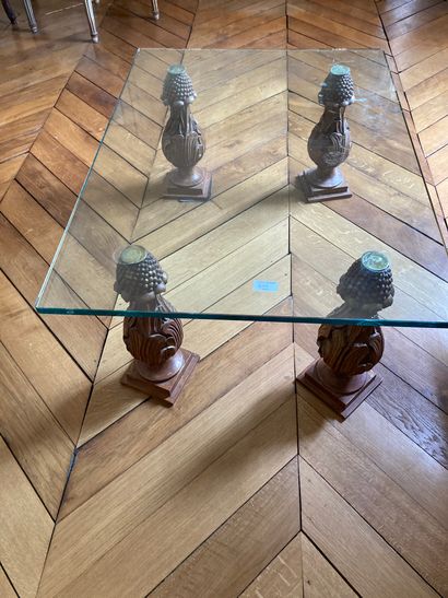 null Coffee table with glass top and carved wooden legs in the form of baluster vases_x000D_.

Modern...