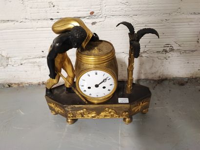 null Clock in gilt bronze, chased and patinated, representing an escalve carrying...