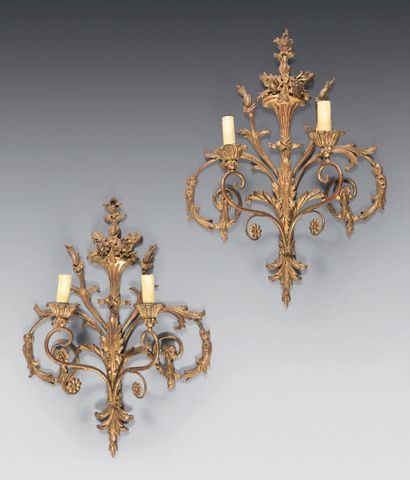 null Pair of two-light sconces in wood/stucco and gilded metal; the shafts with horns...