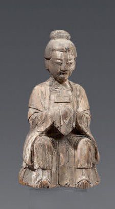 CHINE - XIXe siècle Statuette d'imortelle en bois à traces de polychromie assise,...