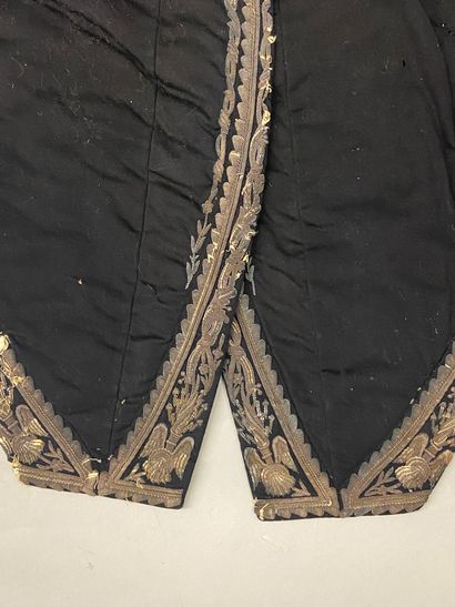 null A general steward's suit in black cloth with silver embroidery, on the right...