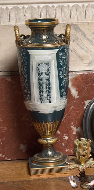 MINTON Porcelain vase with two handles on pedestal decorated with a door and an angel.
Around...