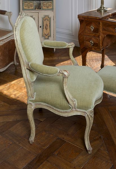 null Armchair with flat back in molded beech, carved and relacquered cream decorated...