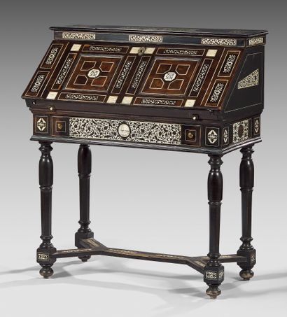 null A sloping desk with a rich inlaid decoration of scrolls and bone reserves on...