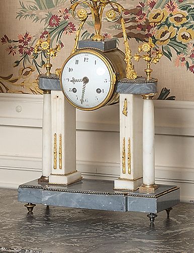 null Portico clock in marble and chased and gilded bronze.
Louis XVI style.
H: 45...
