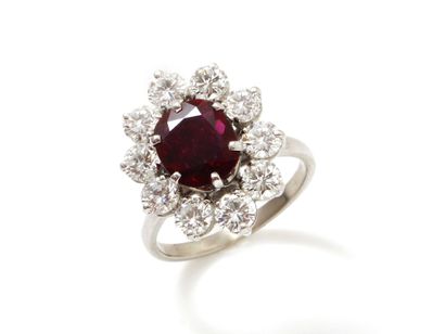 null Ring in white gold 750 thousandths, decorated with a ruby cushion cut in claw...
