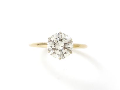null Solitaire ring in gold 585 thousandths, ornamented with a brilliant diamond...