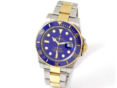 null 
 
ROLEX ''OYSTER PERPETUAL DATE SUBMARINER''
 Montre bracelet d'homme en or...