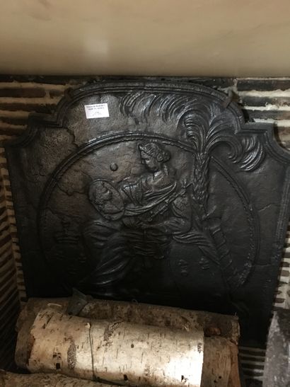 Cast iron fireback decorated with an allegory...