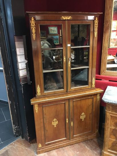 null Mahogany veneered cabinet with blackened fillets and gilt bronze ornaments,...