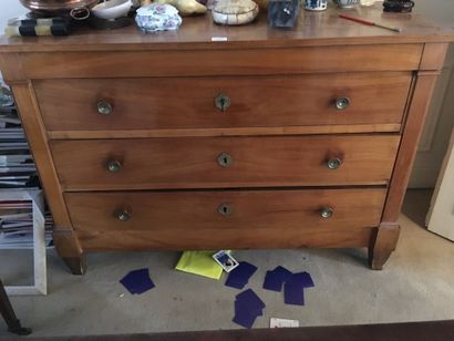 Cherry wood chest of drawers opening with...