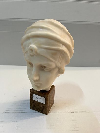 Alabaster bust representing a woman with...