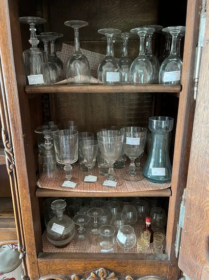 null Various glassware: carafes, glasses with feet, glasses with alcohol 

Worn and...
