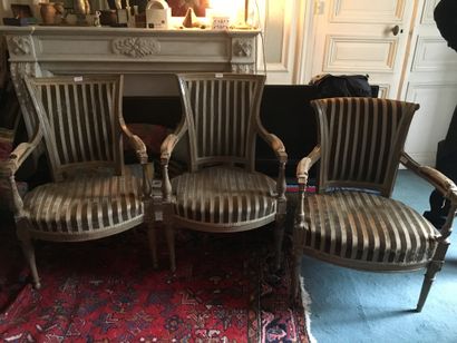 null Three armchairs of which a pair in lacquered wood with gondola back, the third...