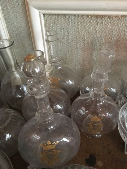 null Five decanters, monogrammed CV in gold under marquis crown (3 stoppers missing)...