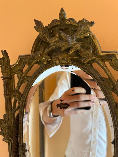 Gilt bronze mirror with a quiver decoration...