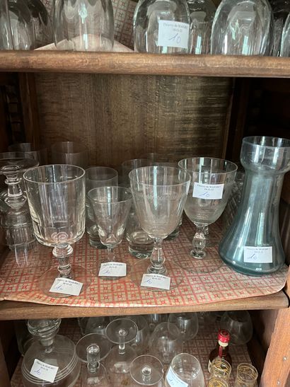 null Various glassware: carafes, glasses with feet, glasses with alcohol 

Worn and...