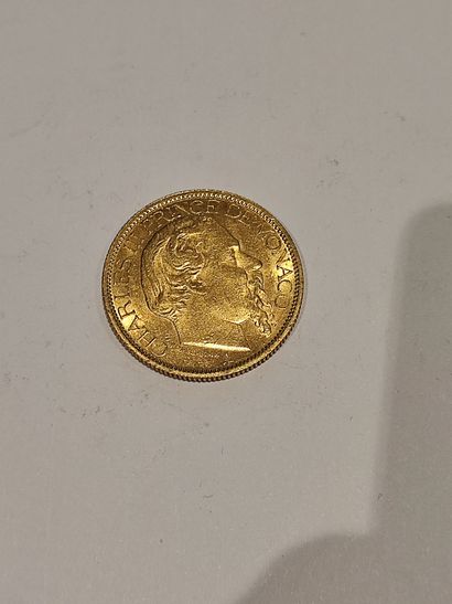 null Pièce de 100 Francs or Charles III de Monaco, datée 1884.
32.20 g.
