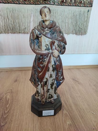 null Saint Laurent - Statuette en bois sculpté relaqué - Haut.: 30 cm. Accidents...