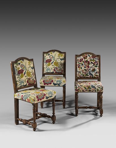 Suite of three chairs in molded or turned...