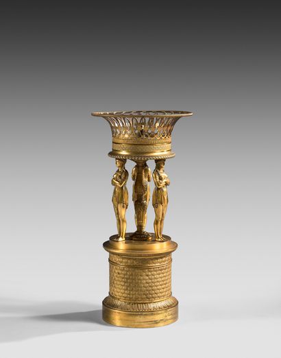Basket in chased and gilded bronze, the latter...