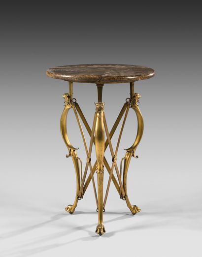 Small pedestal table with onyx top resting...
