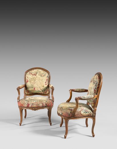 Pair of armchairs in molded and carved walnut,...