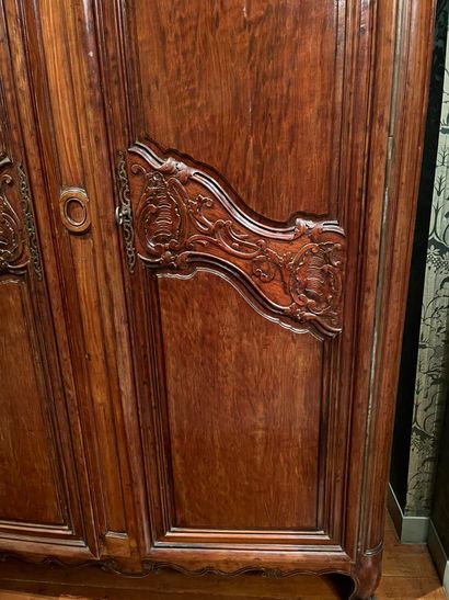 null Mahogany cabinet called "de port" molded and carved with rocaille 
and foliated...