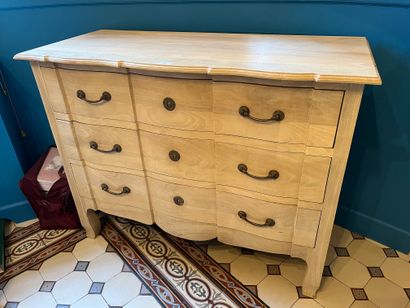 Natural wood chest of drawers, opens with...