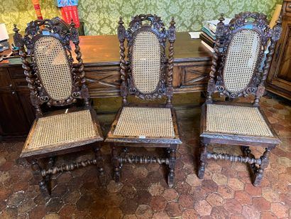 Suite of three caned chairs in stained wood,...